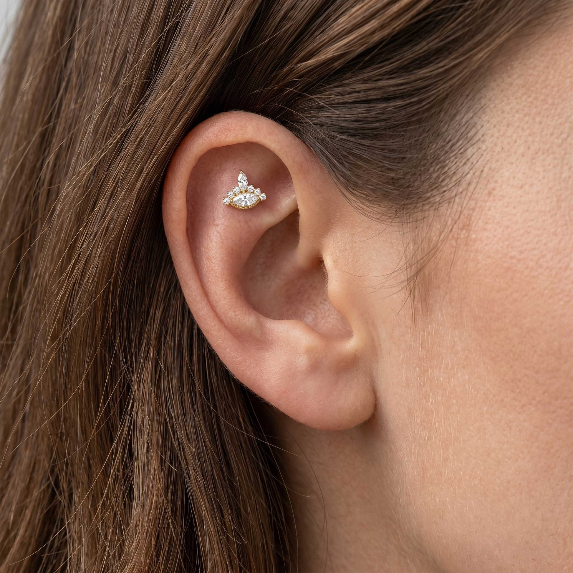 Silver evil eye stud — flat helix piercing placement