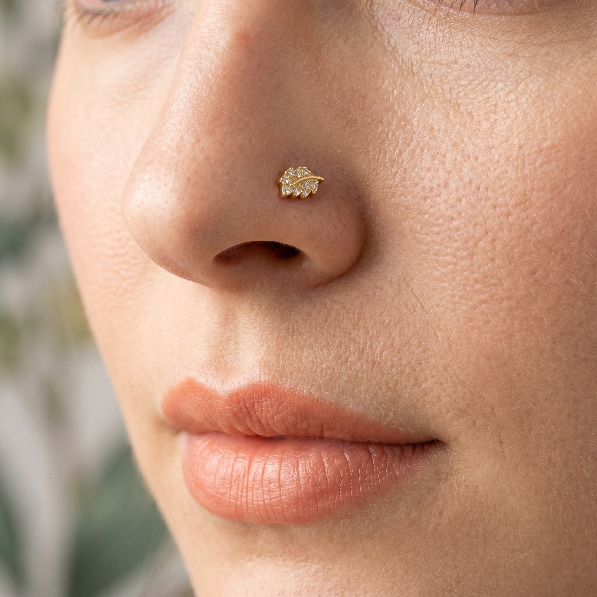 leaf nose stud close-up on a model — single nostril nose jewelry