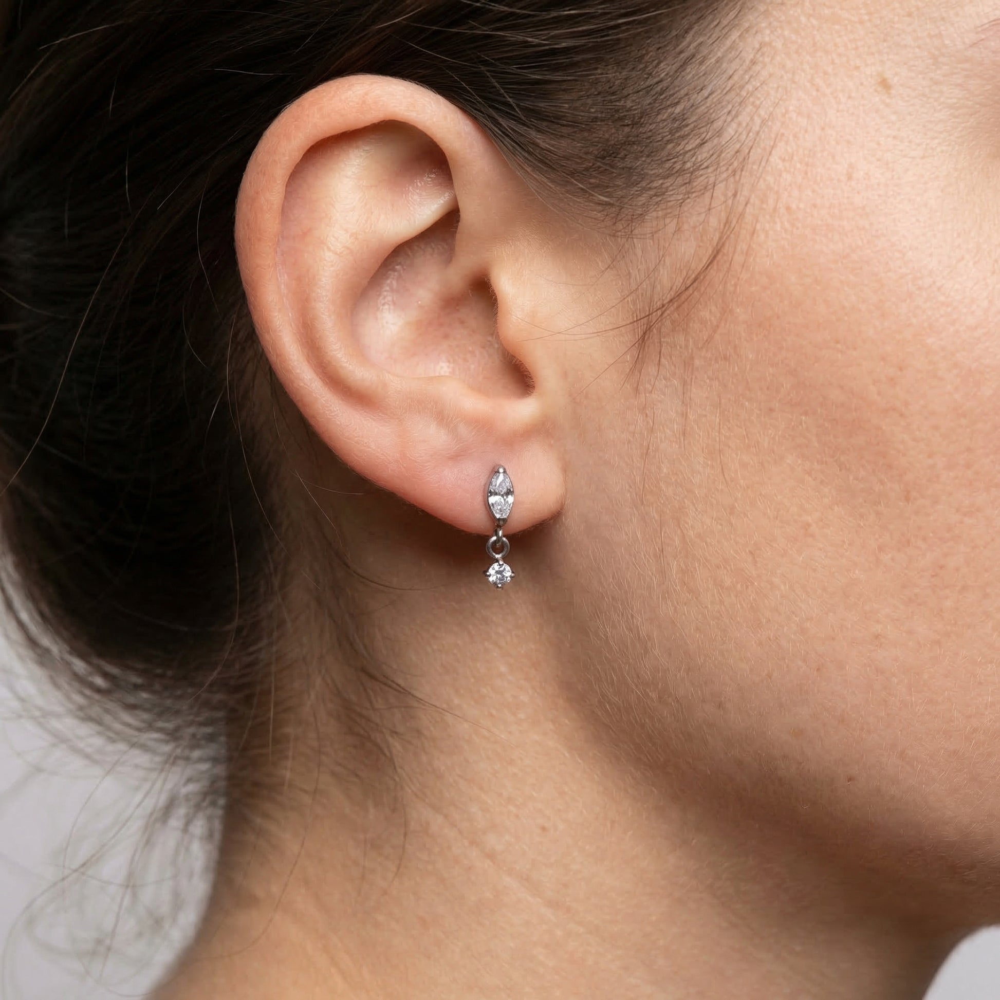 Silver marquise drop styled as a lower ear accent.