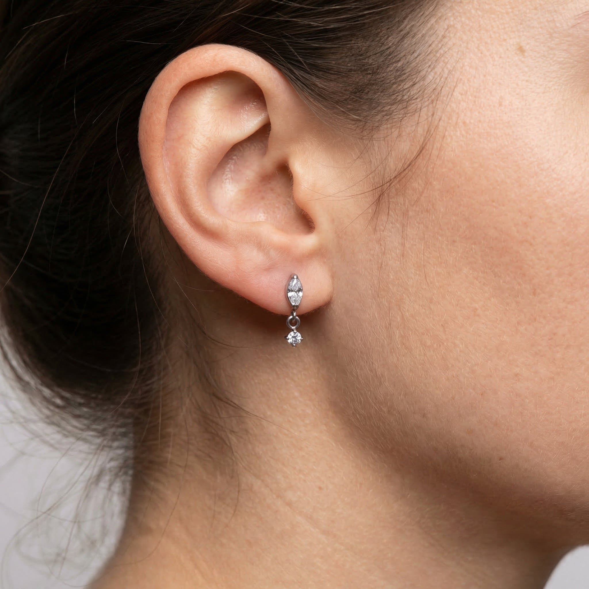 Silver marquise drop styled as a lower ear accent.