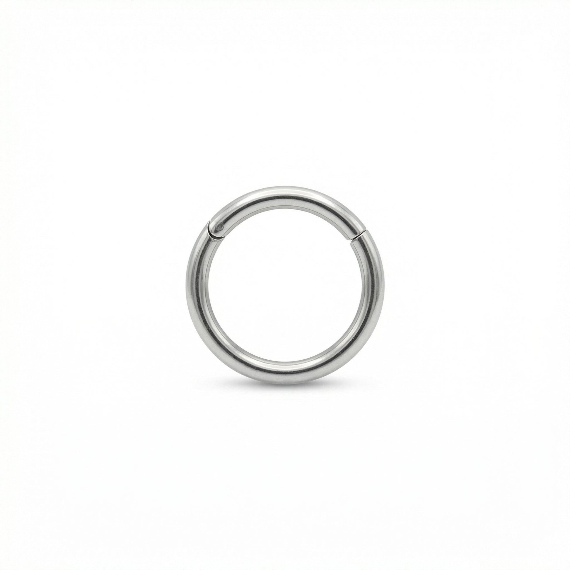 16G G23 titanium silver plain minimalist hinged clicker hoop displayed on a
