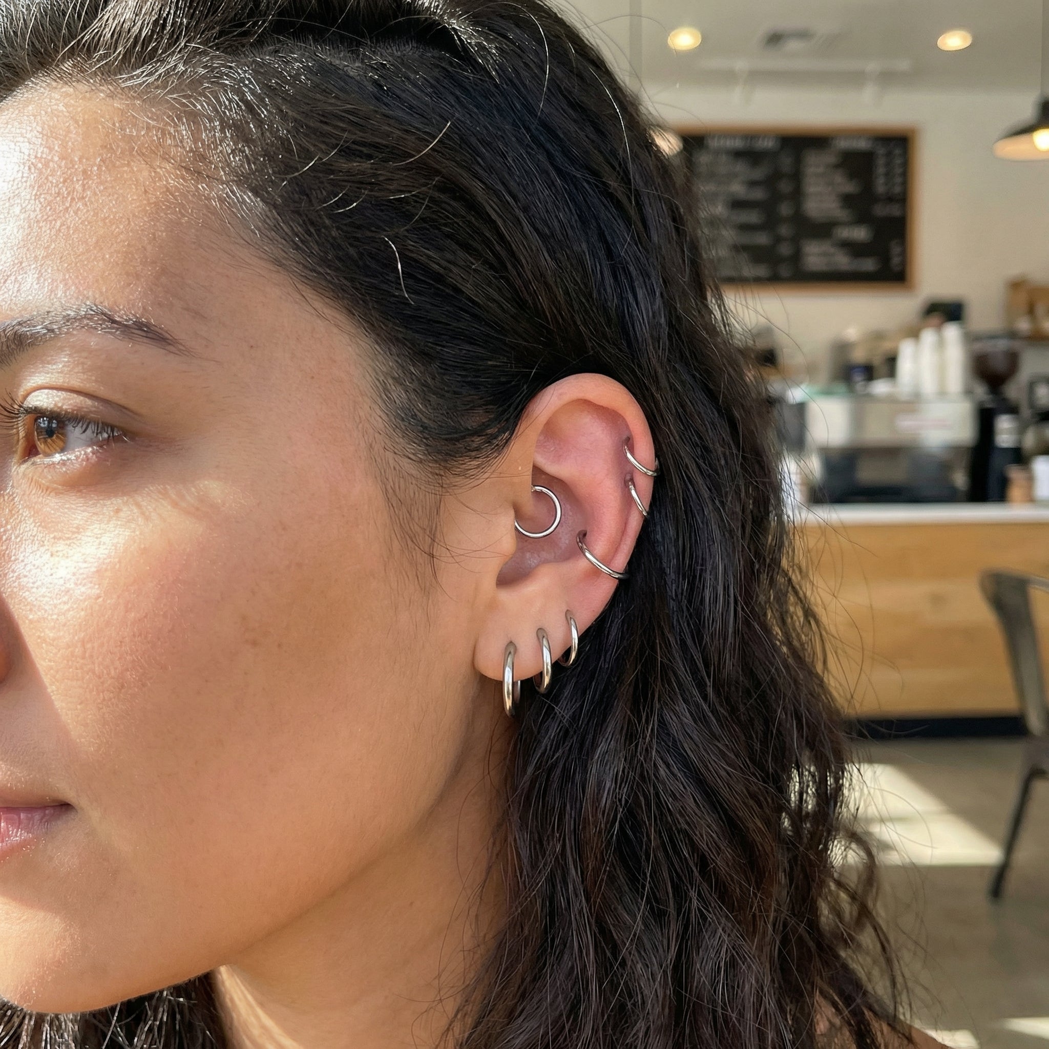Minimalist Piercing In Septum - Model displaying a gold