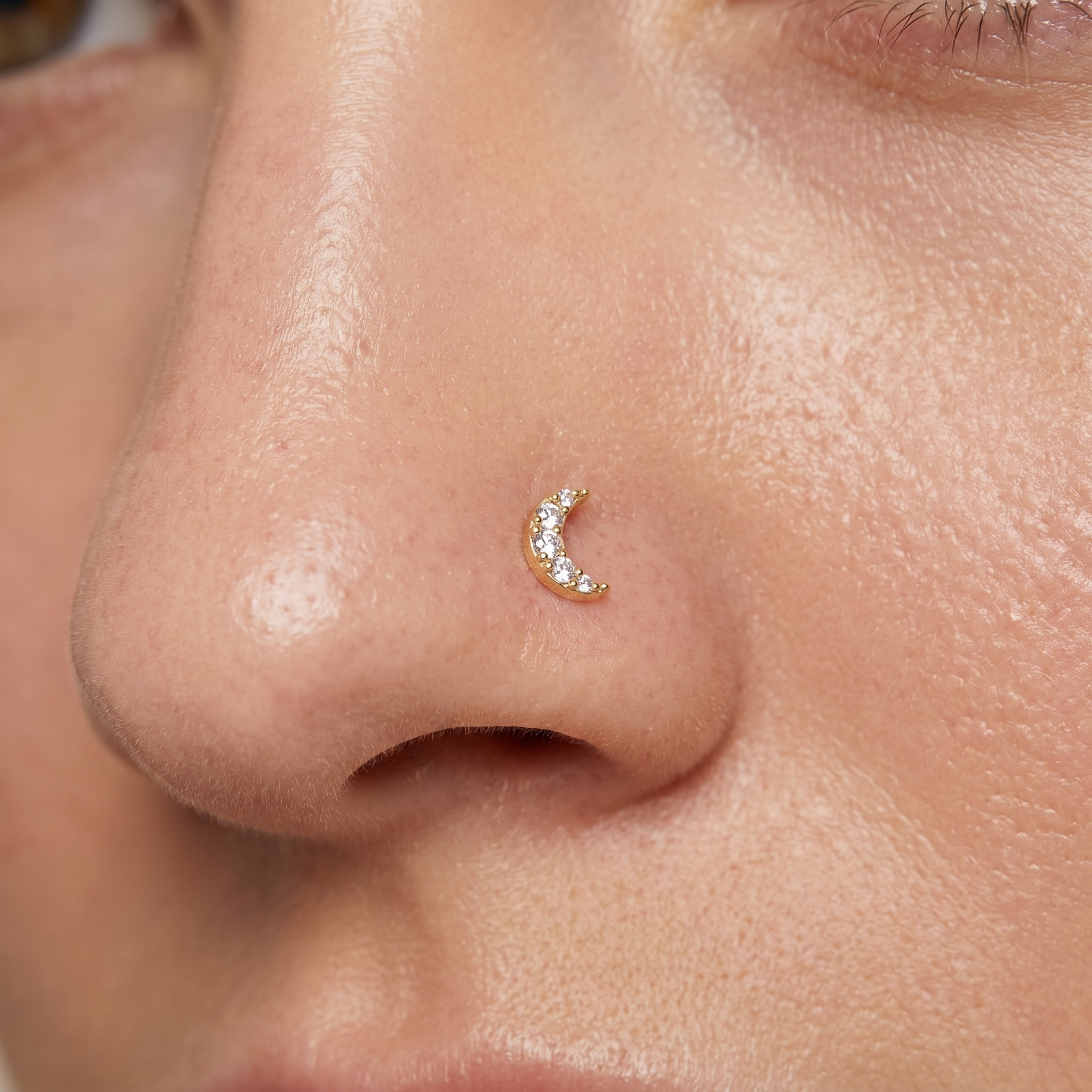 moon nose stud close-up on a model — single nostril nose jewelry