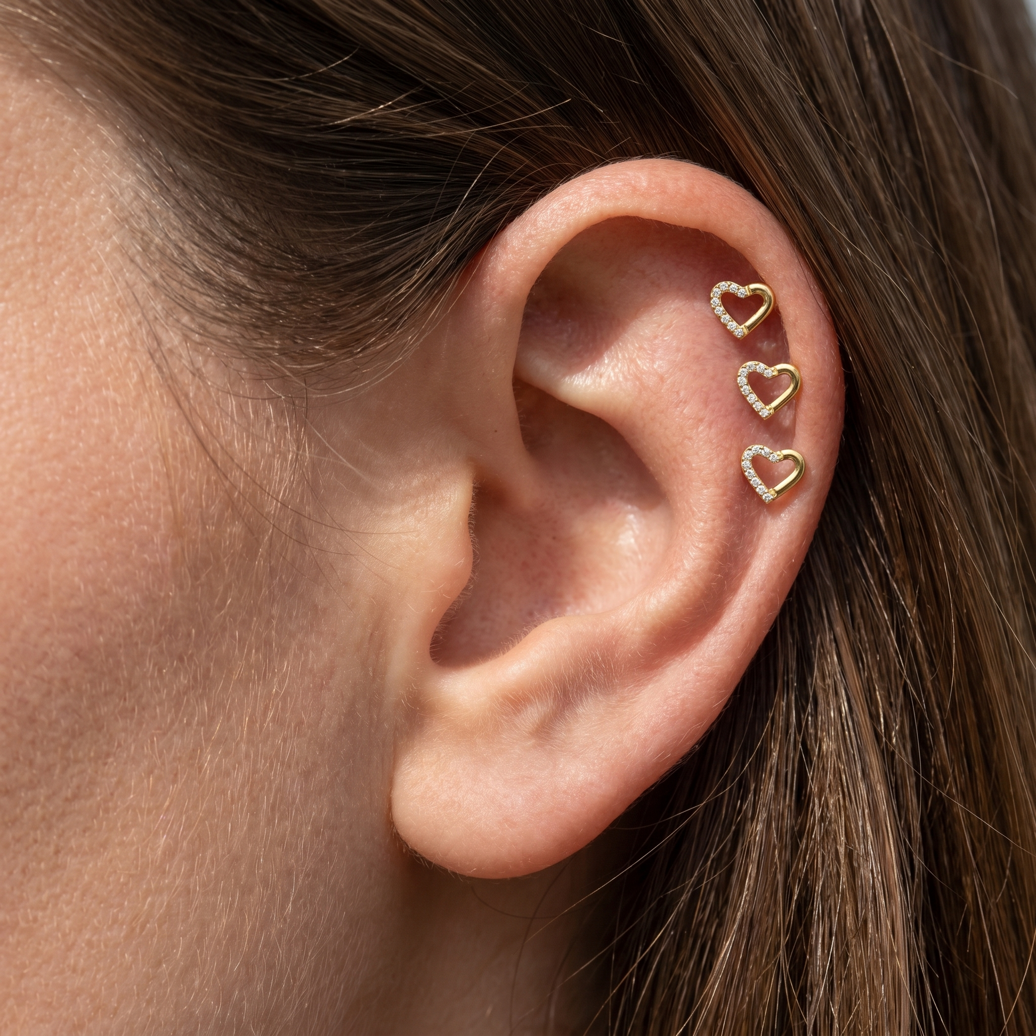 Cartilage Ear Piercing Earrings - Three gold open heart studs styled beautifully