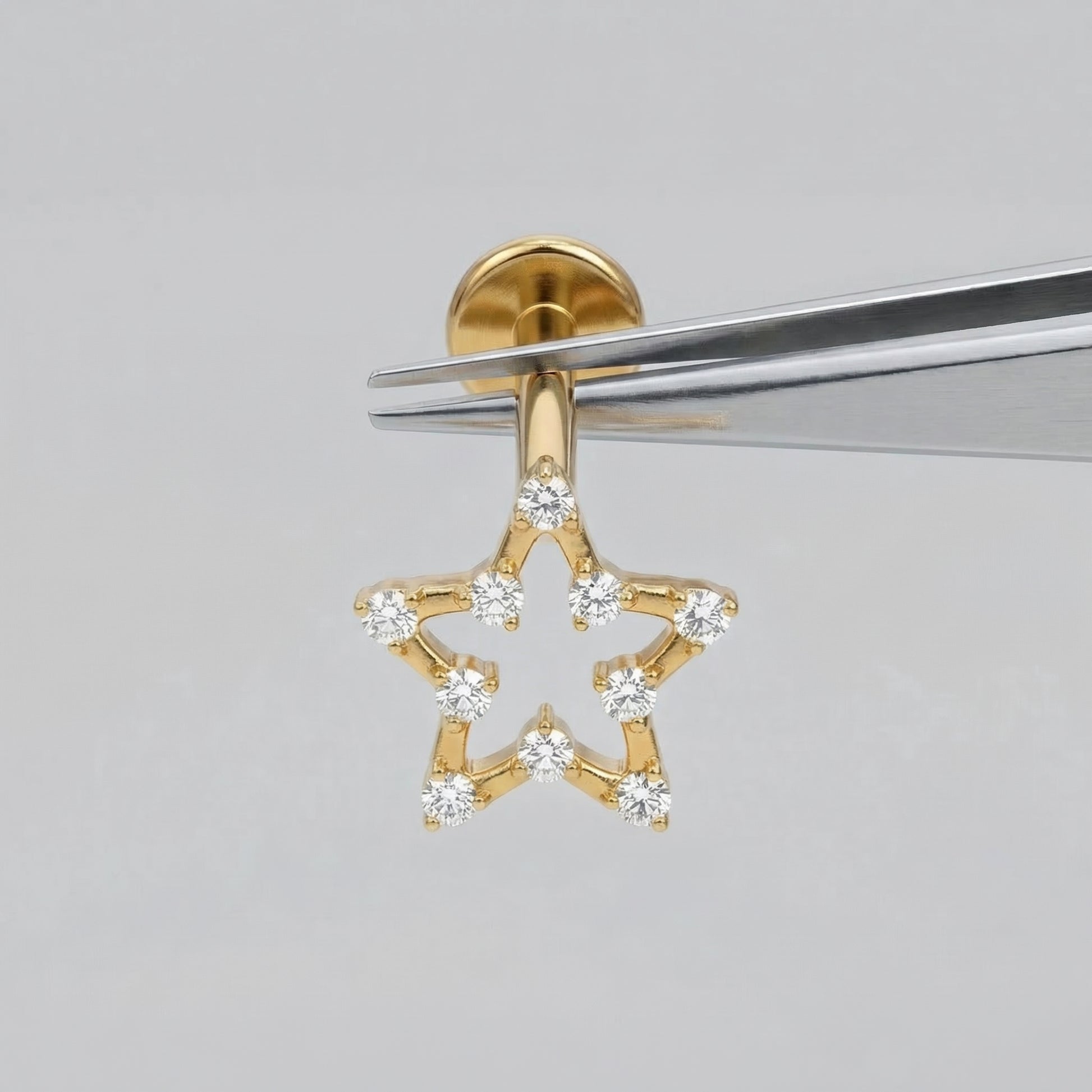 Open Front Helix Piercing - Gold open star piercing