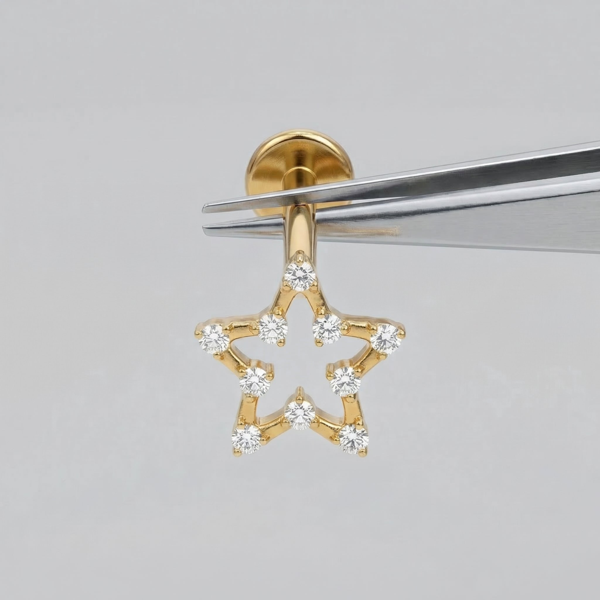 Open Front Helix Piercing - Gold open star piercing