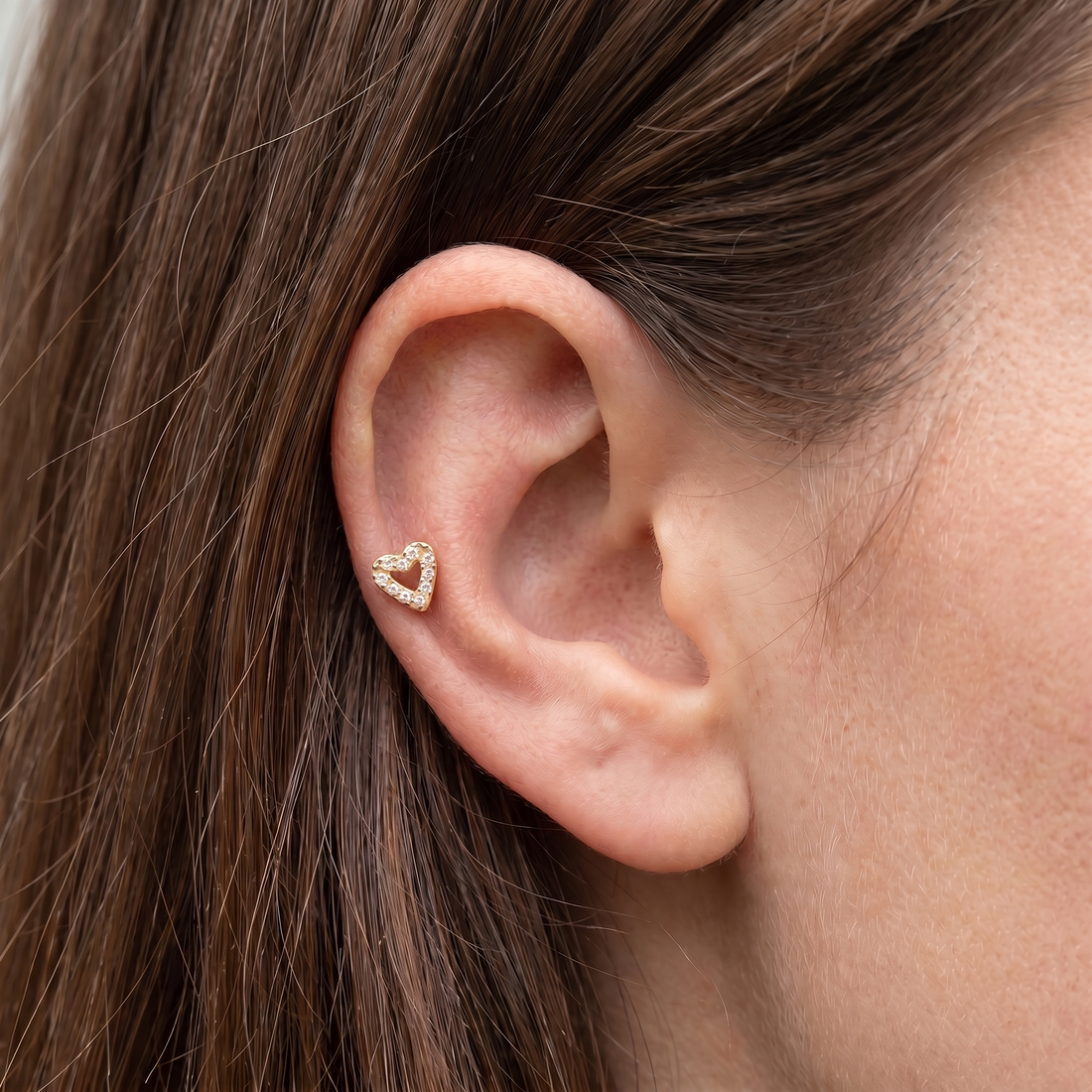 Gold paved heart zircon stud — mid helix piercing placement
