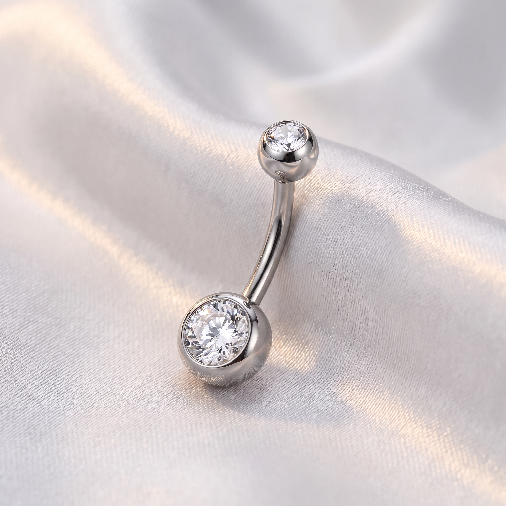 Petite Double Gem CZ belly button ring in silver 10 mm on champagne satin — G23 titanium 14G