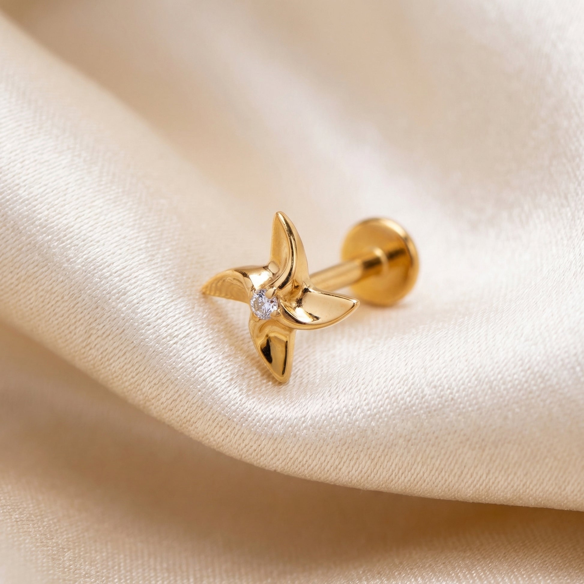 Pinwheel Medusa Piercing Jewelry - Gold titanium resting gracefully