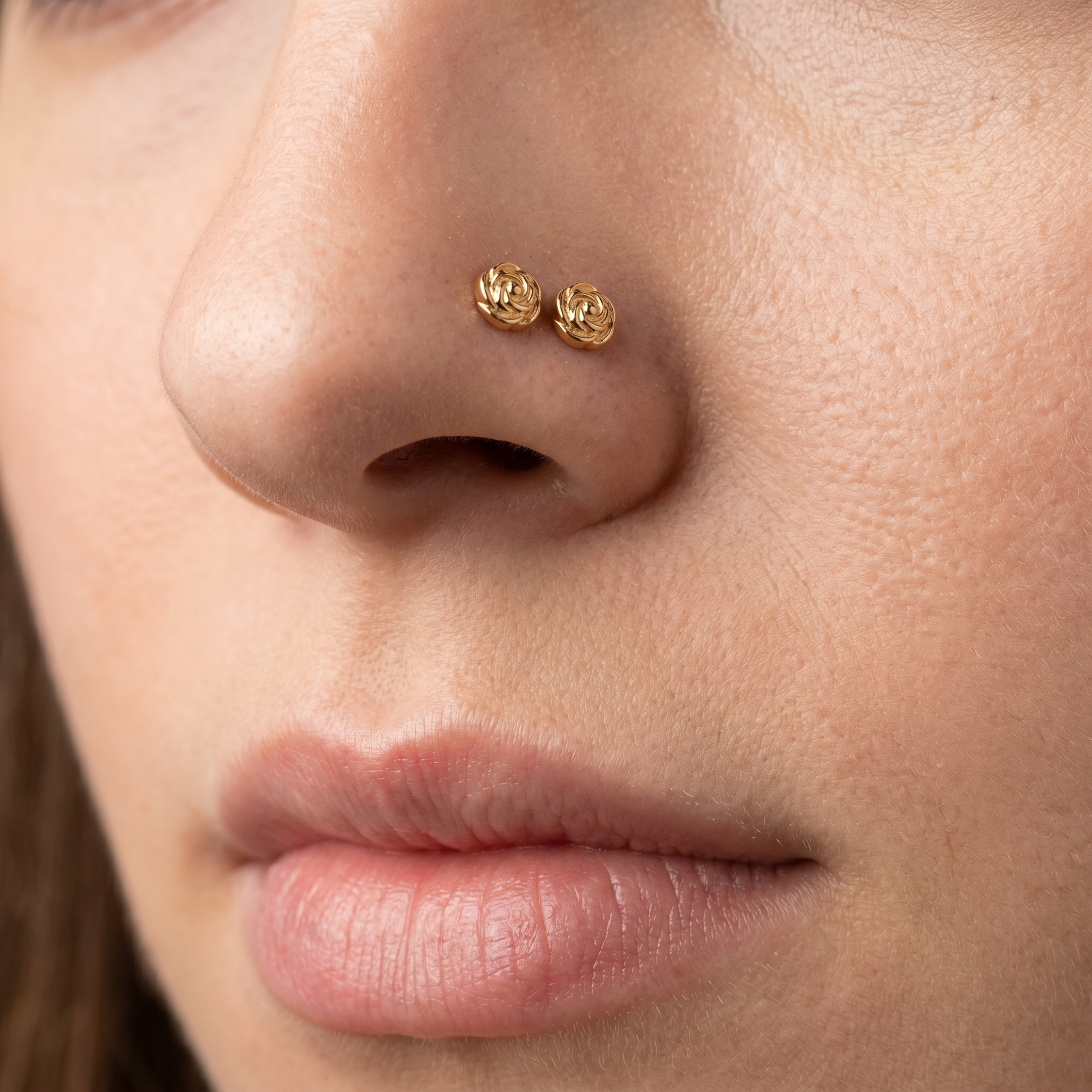 rose nose stud in gold on a white background — G23 titanium 20G