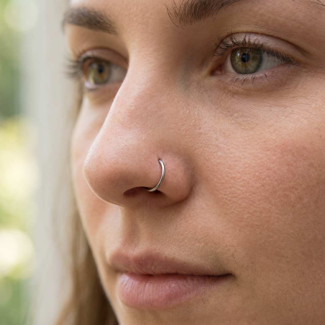 seamless nose hoop close-up on a model — single nostril nose jewelry