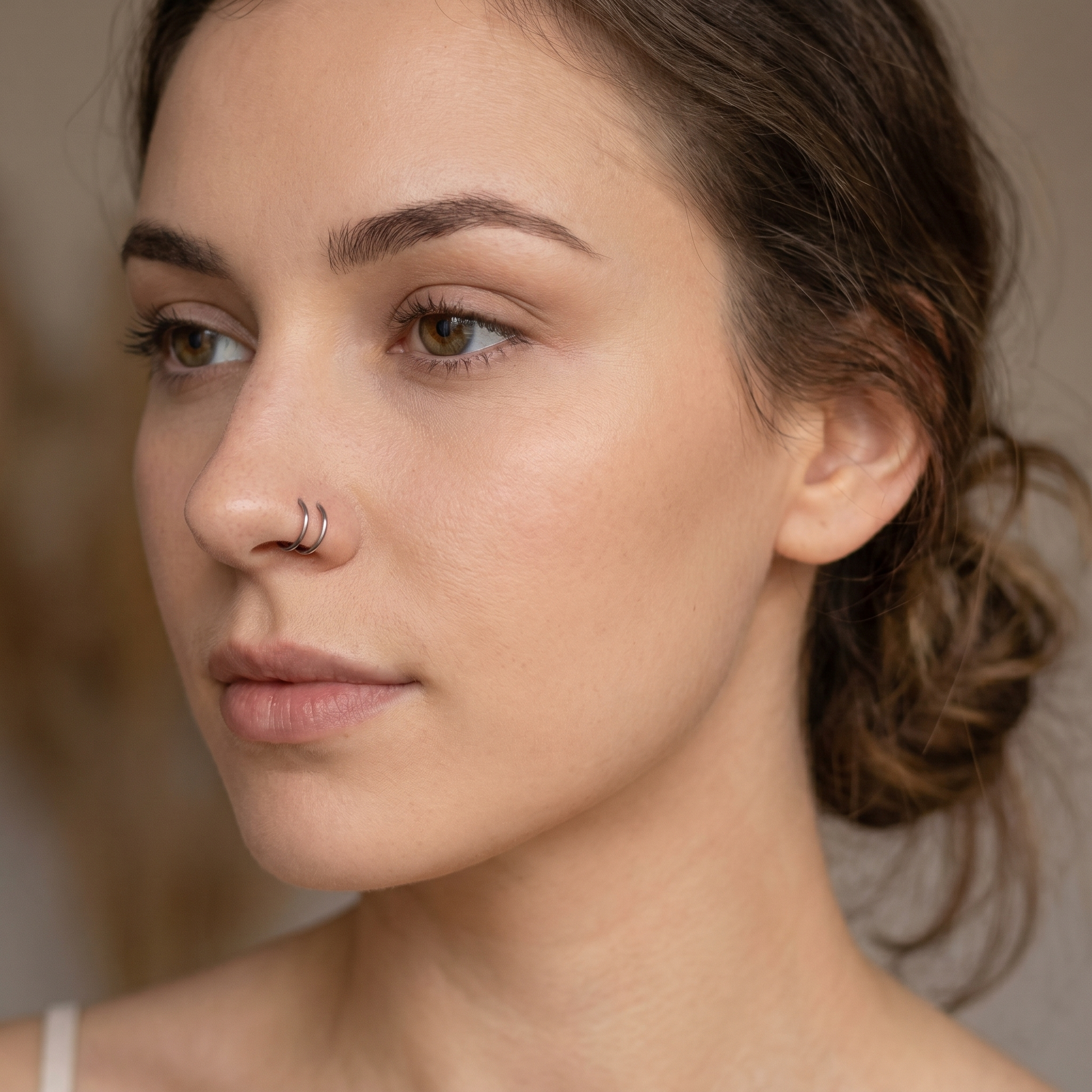 seamless nose hoop worn on a model — hypoallergenic titanium
