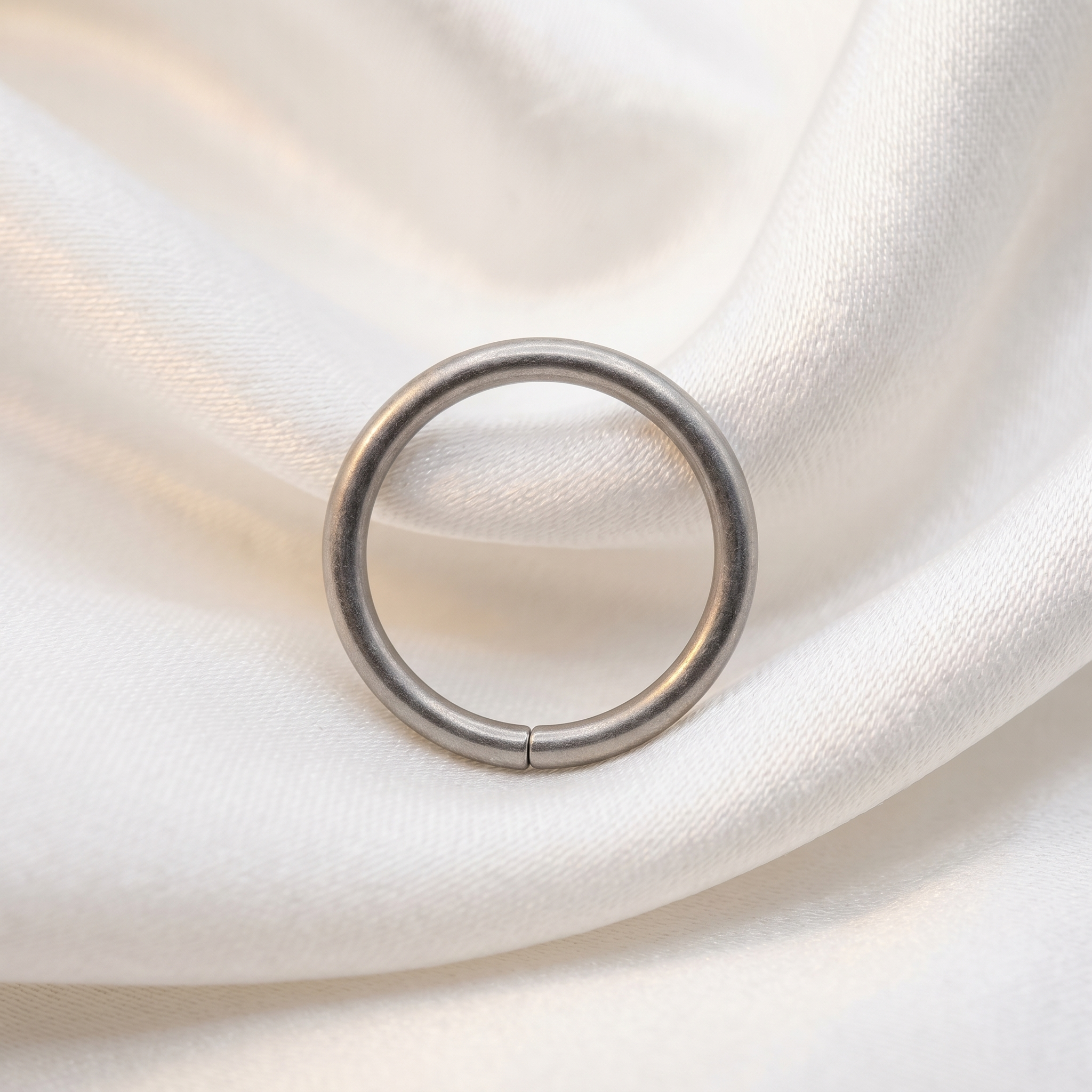 seamless nose hoop on satin fabric — G23 titanium 20G