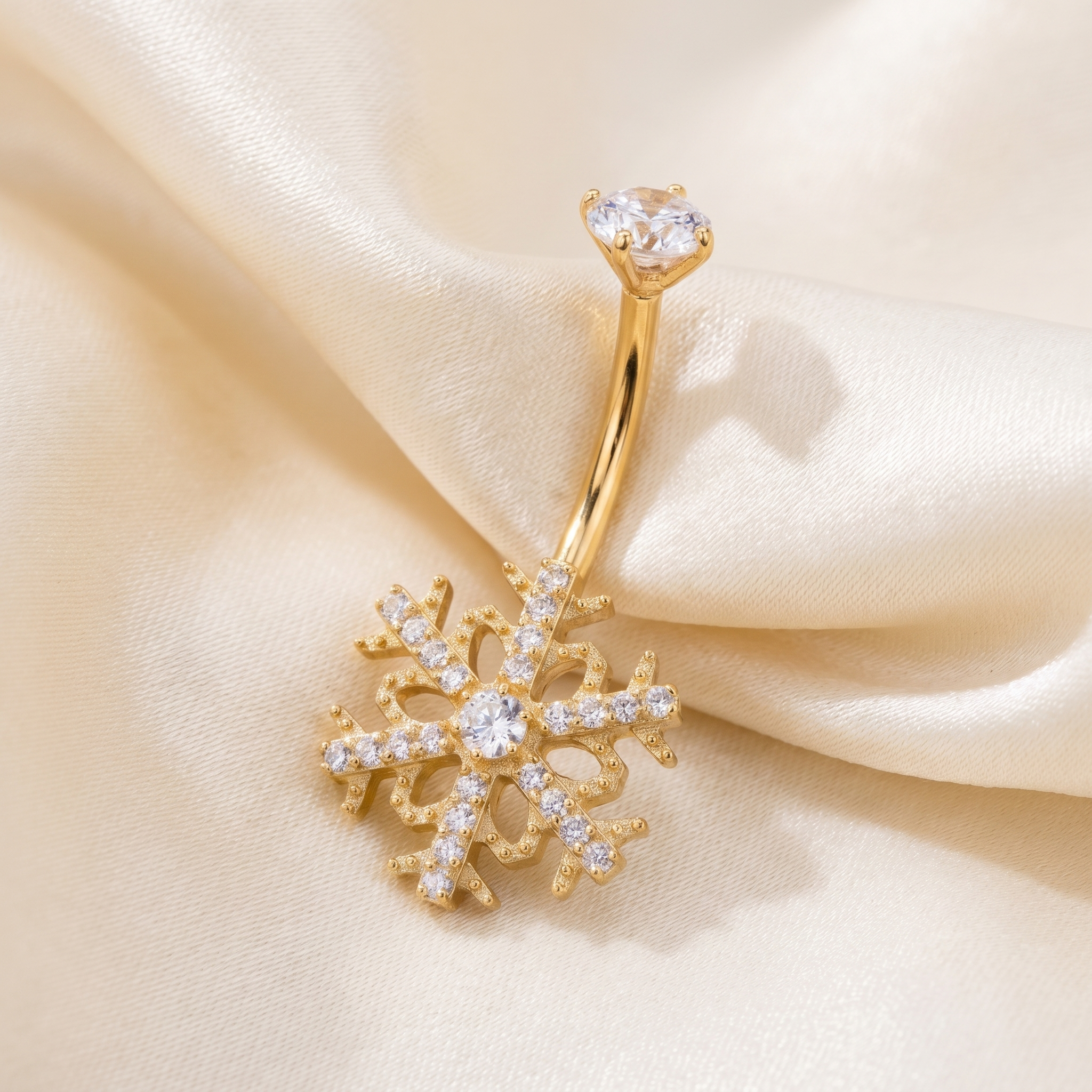 Floating Belly Button Piercing - Close up gold snowflake