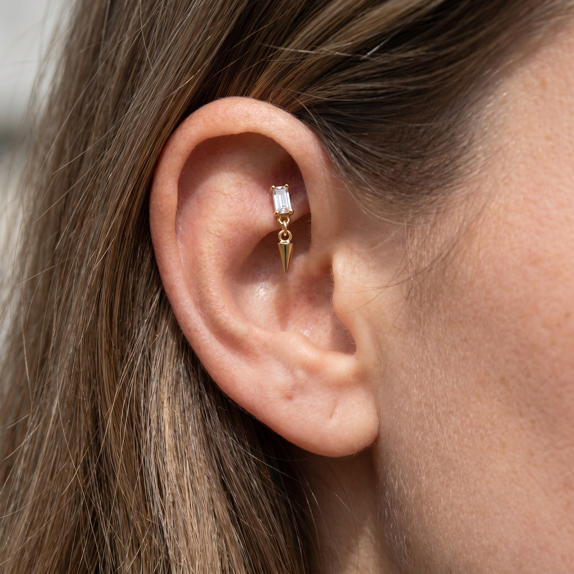 Gold spike dangle stud — faux rook piercing placement