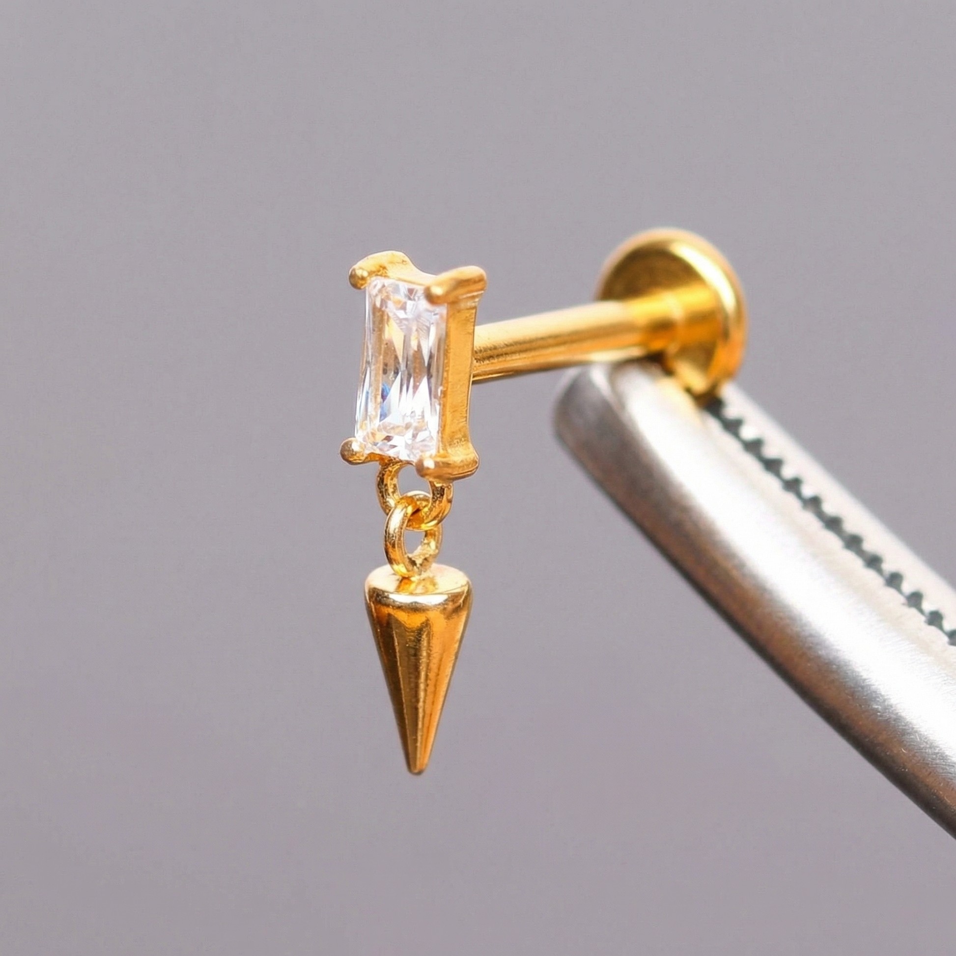 Spike Front Helix Piercing - Gold titanium earring held