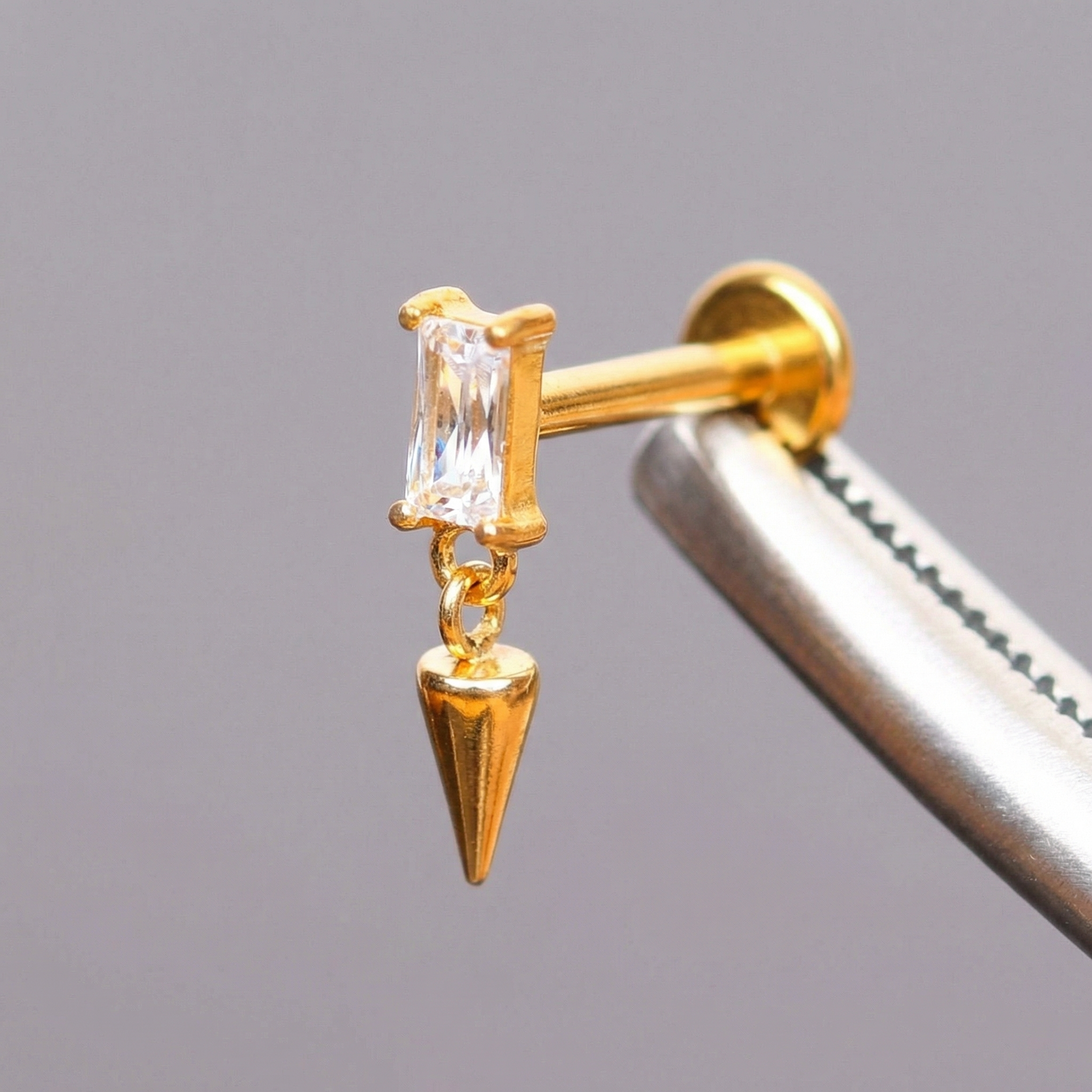 Spike Front Helix Piercing - Gold titanium earring held