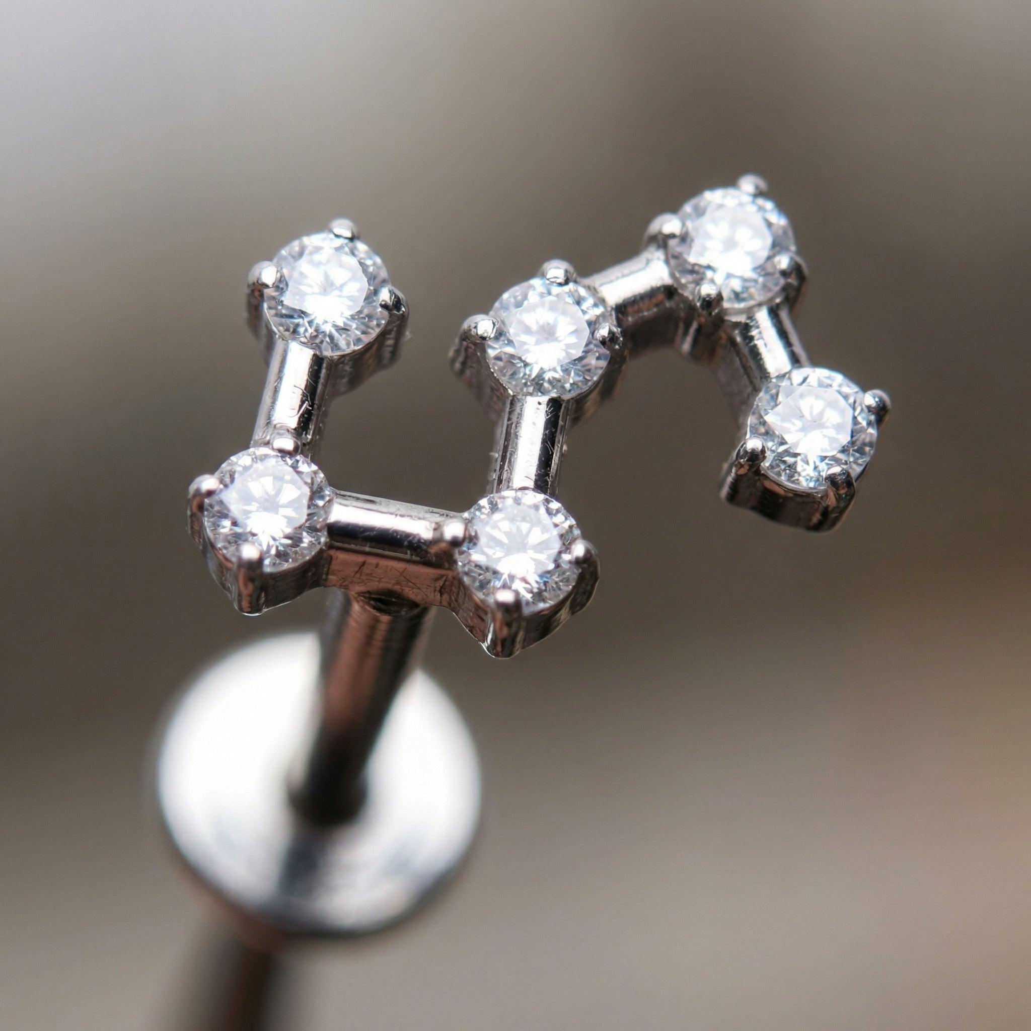 Star Hidden Helix Piercing - Close-up macro view of
