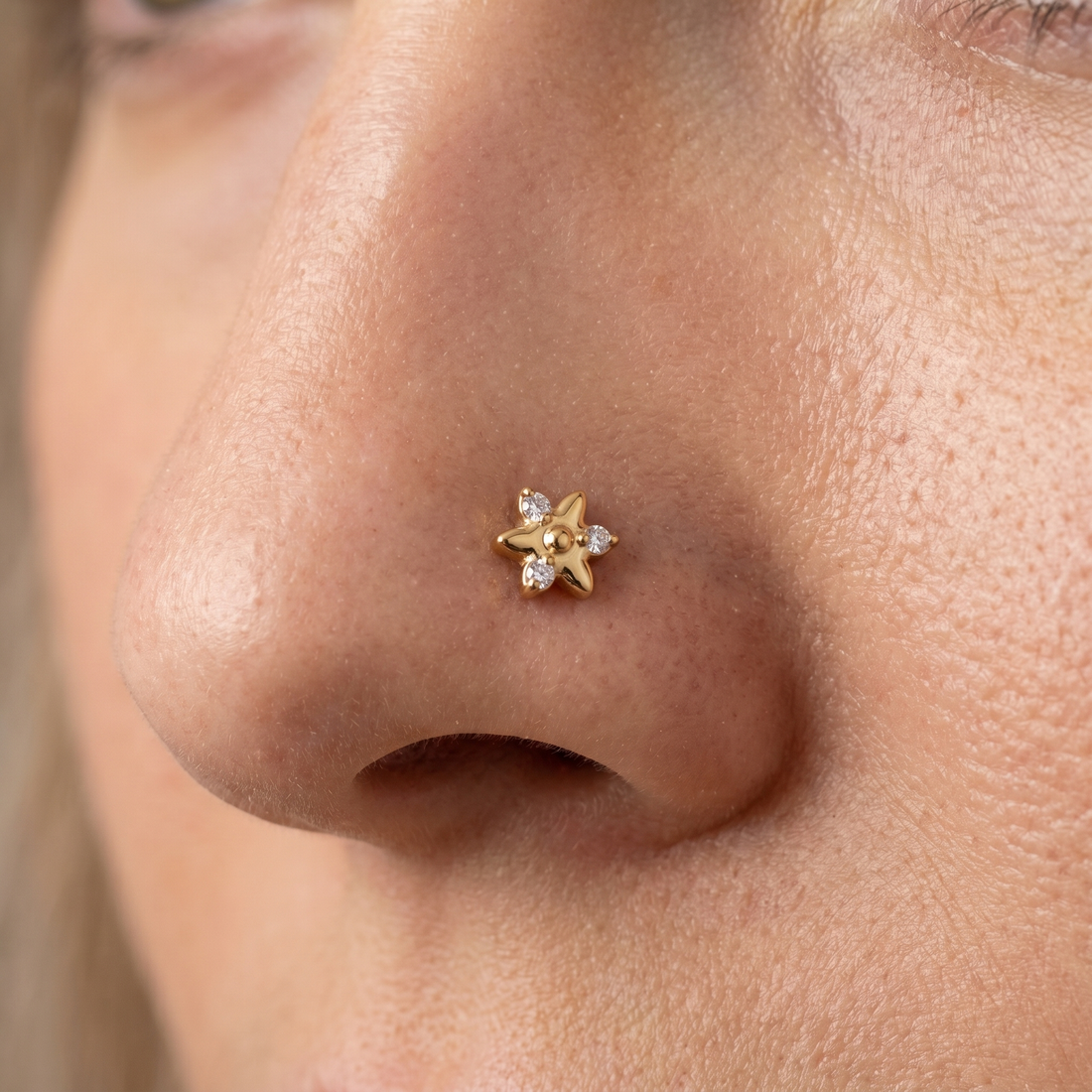 star nose stud close-up on a model — single nostril nose jewelry