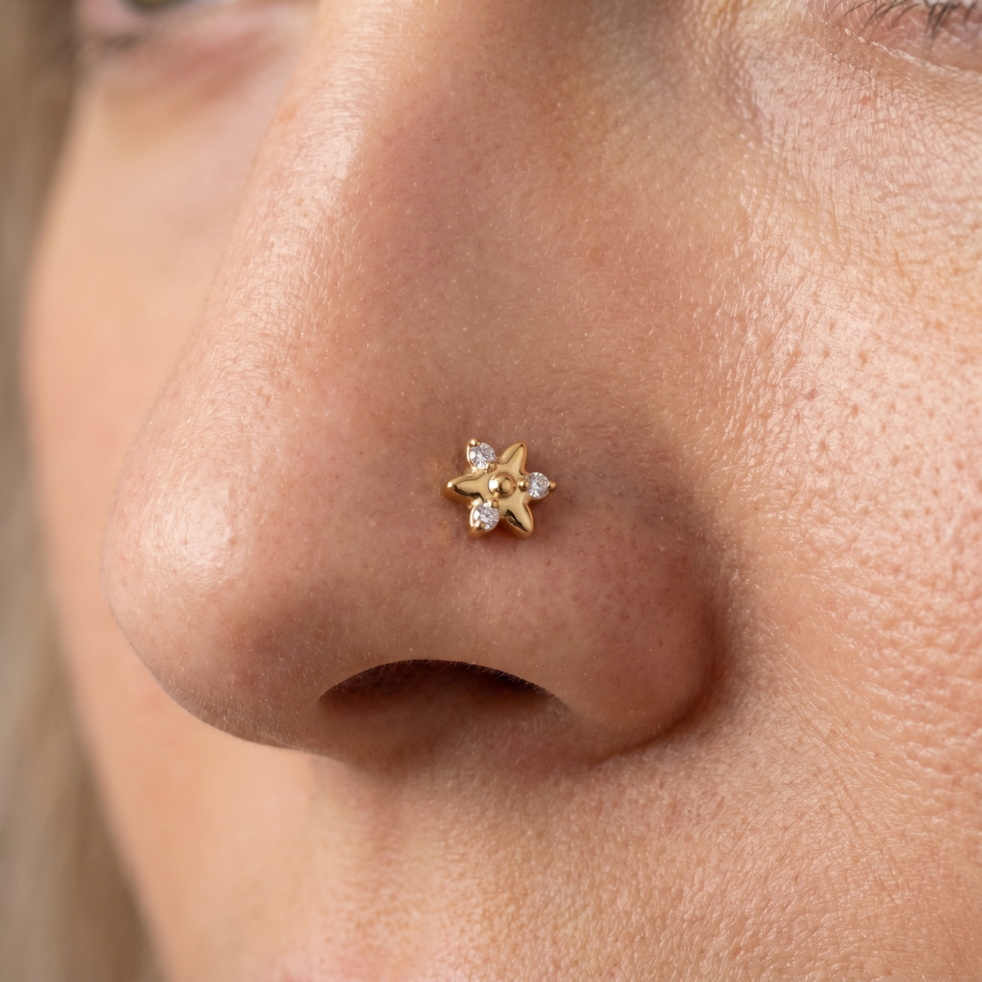star nose stud close-up on a model — single nostril nose jewelry