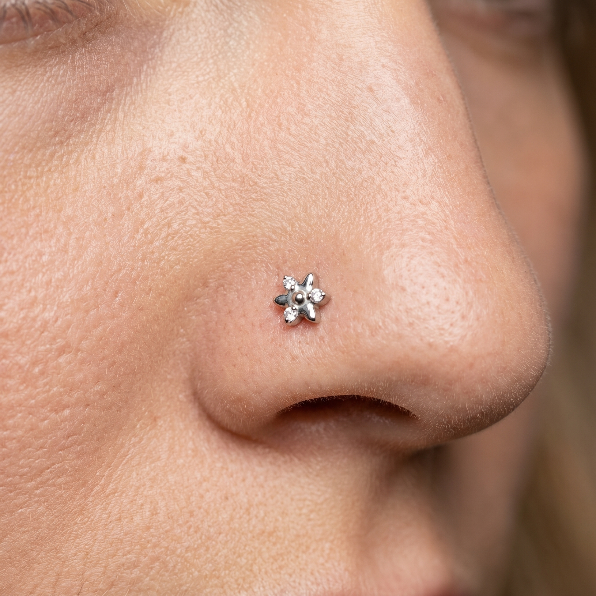 star nose stud worn on a model, side profile