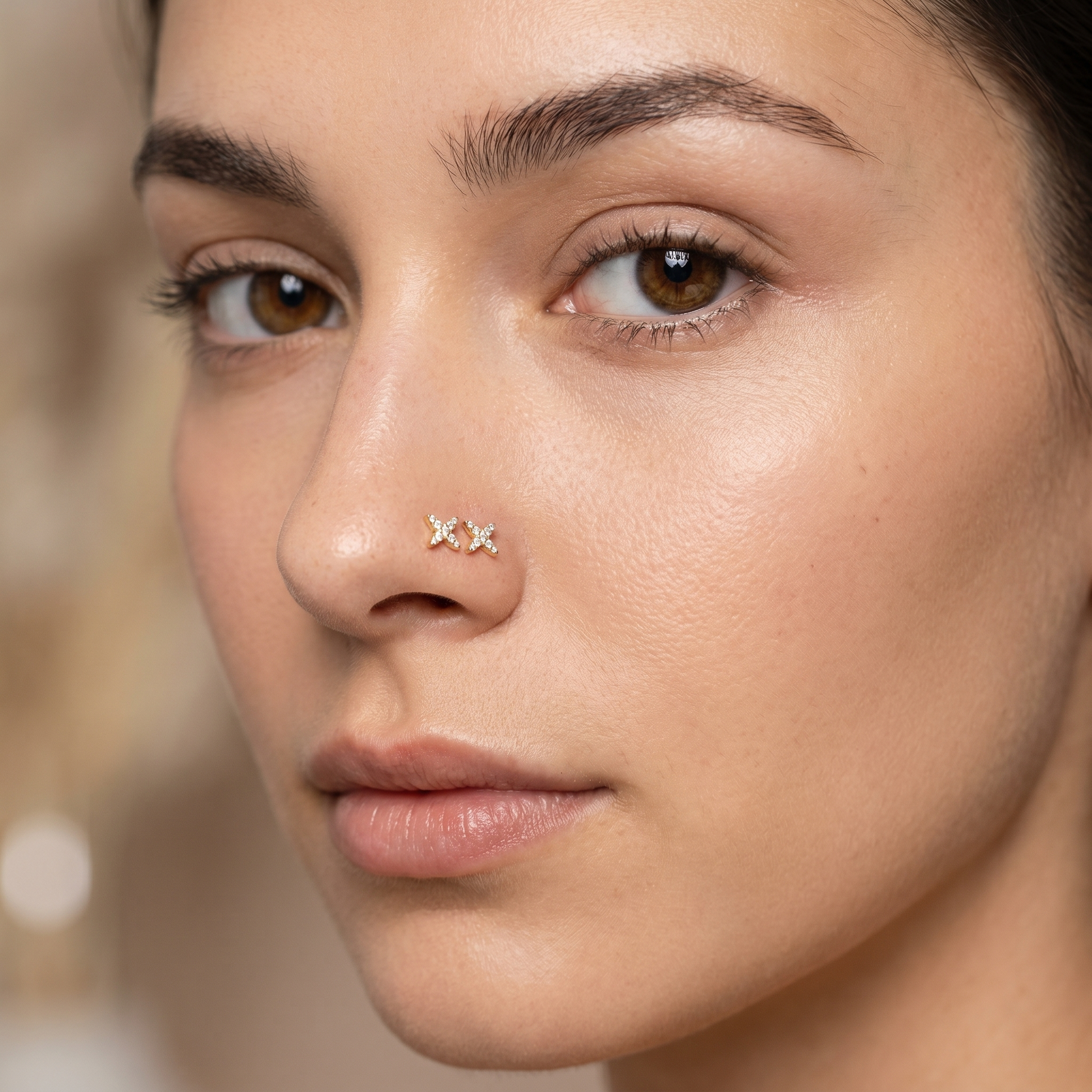 starburst nose stud worn on a model — hypoallergenic titanium