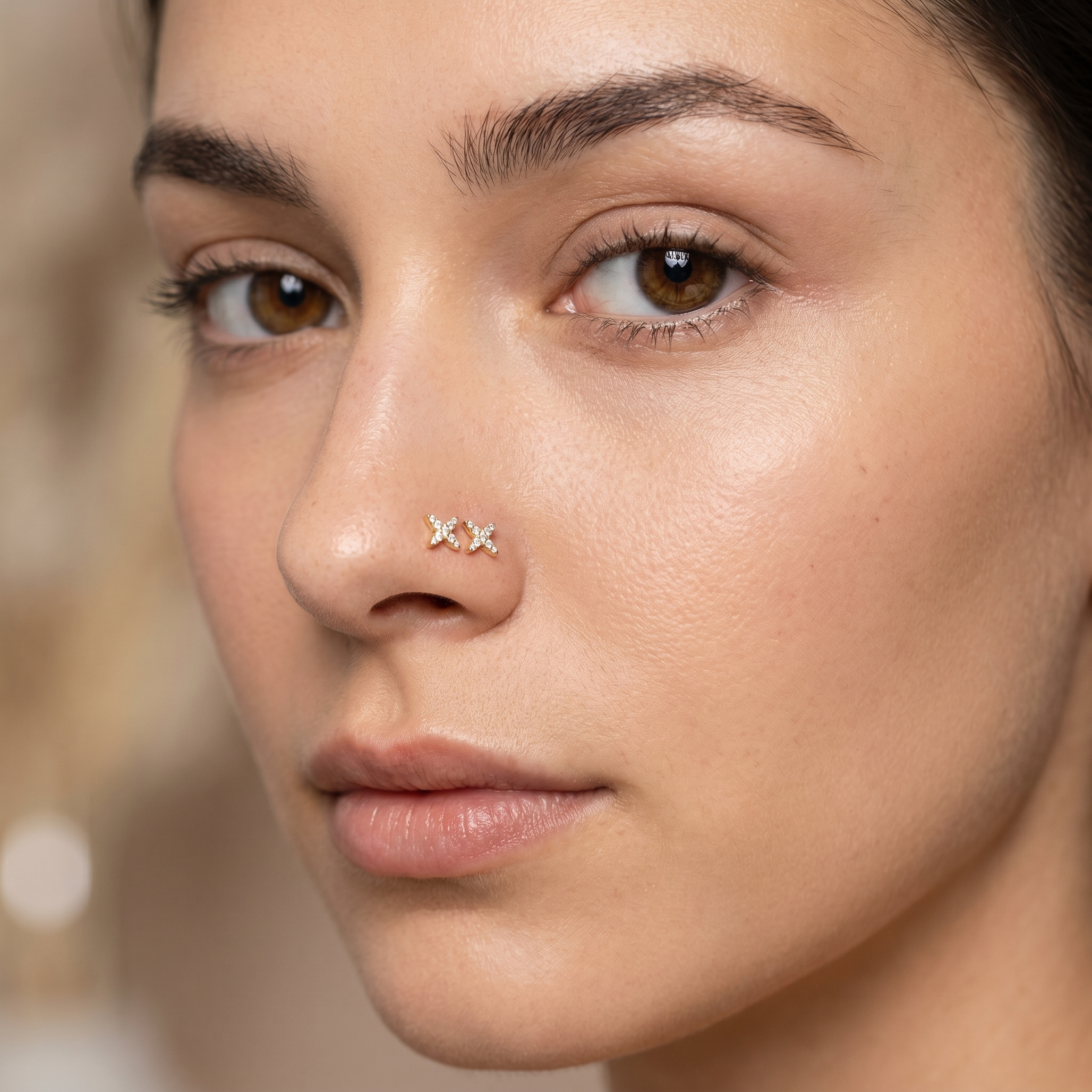 starburst nose stud worn on a model — hypoallergenic titanium