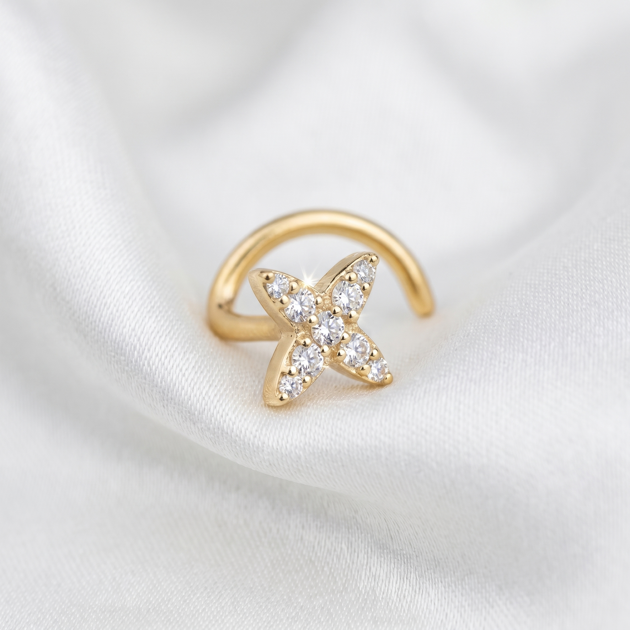 starburst nose stud on satin fabric — G23 titanium 20G