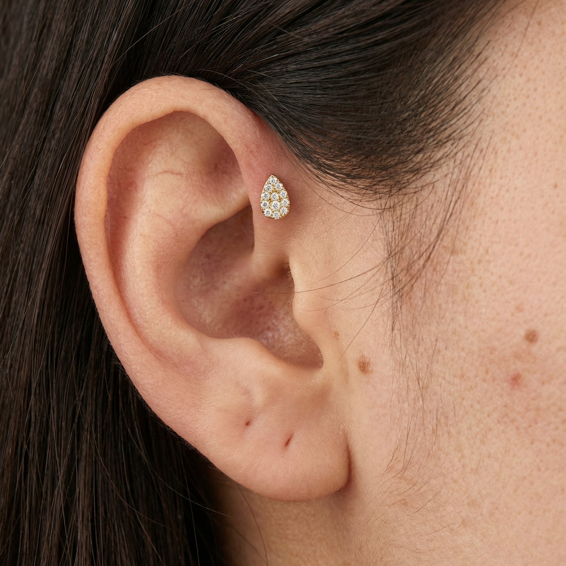 Silver teardrop zircon stud — forward helix piercing placement