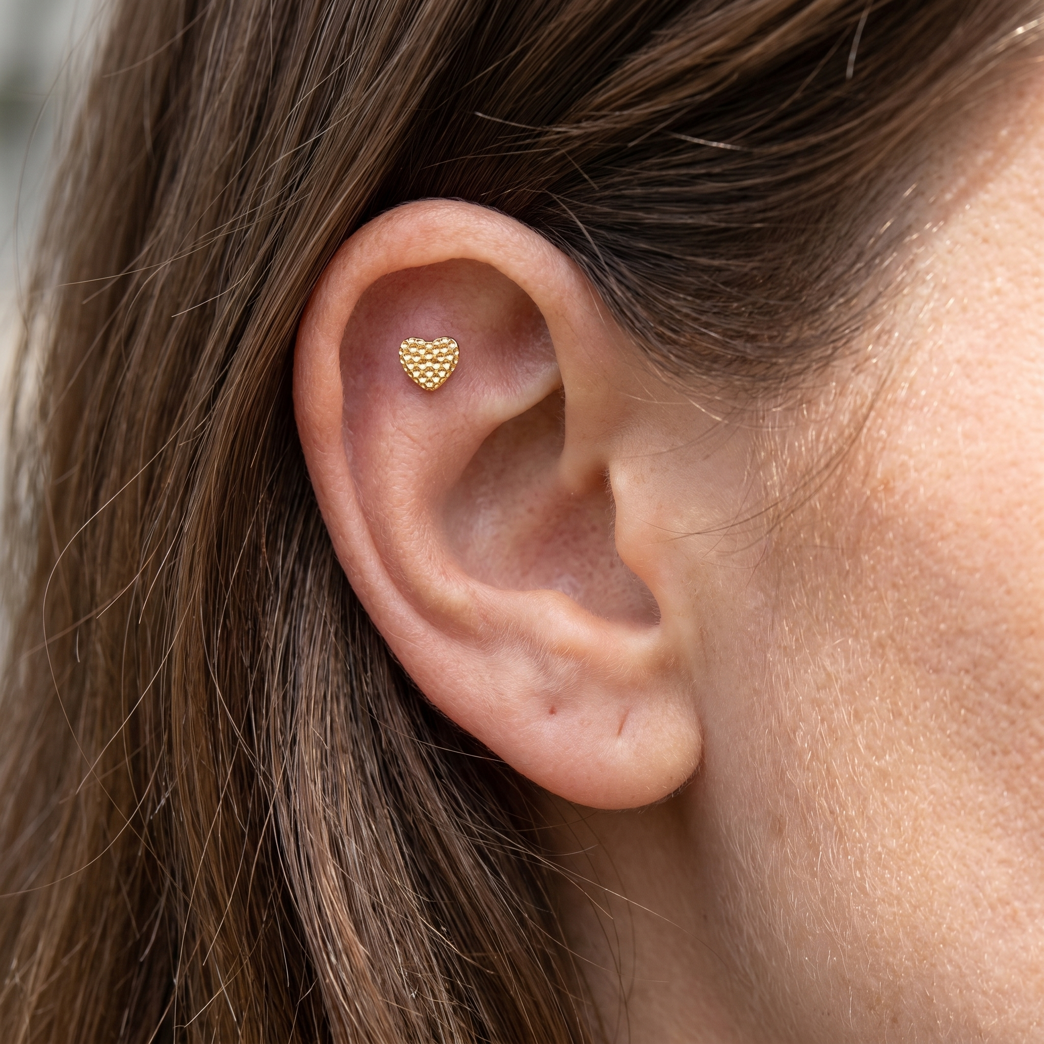 Gold textured heart stud — flat helix piercing placement