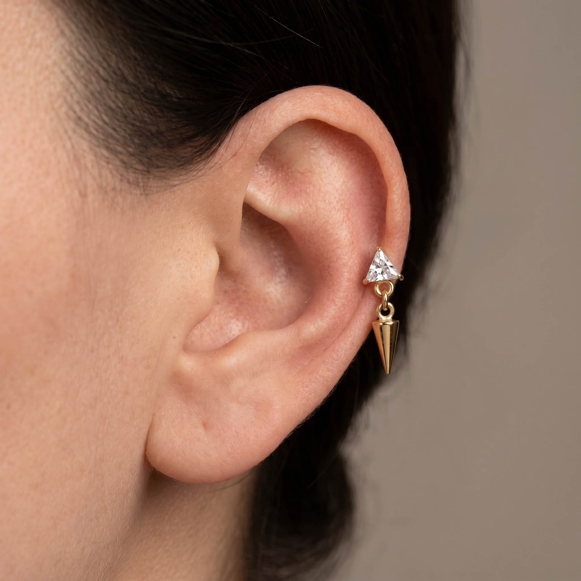 Gold triangle zircon spike stud — mid helix piercing placement