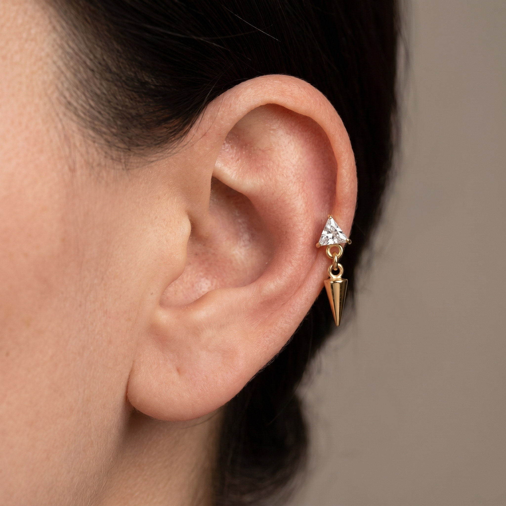 Gold triangle zircon spike stud — mid helix piercing placement