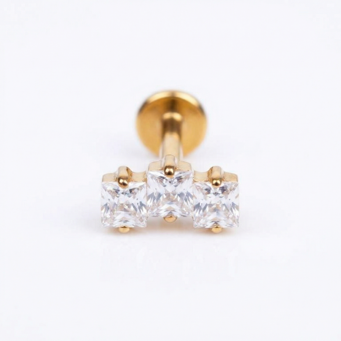 Gold triple zircon stud — conch jewelry placement