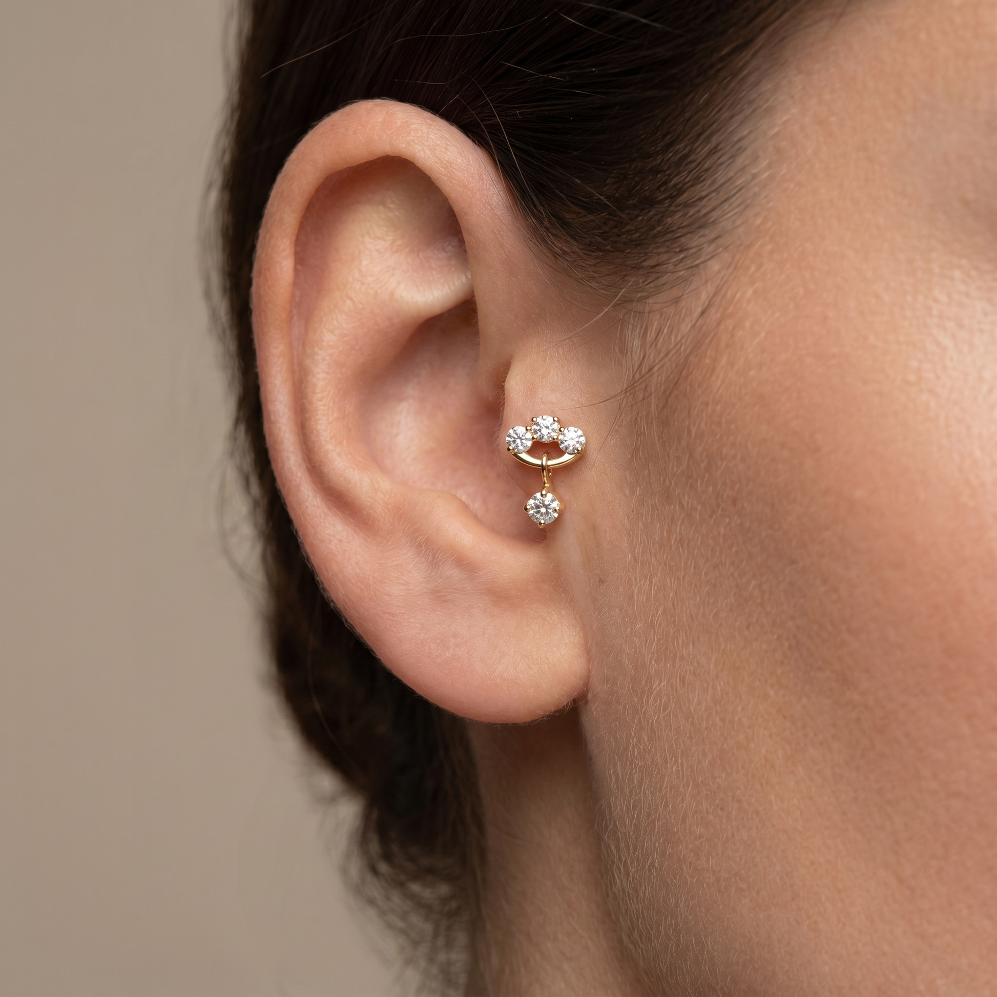 Gold triple zircon dangle stud — tragus jewelry placement