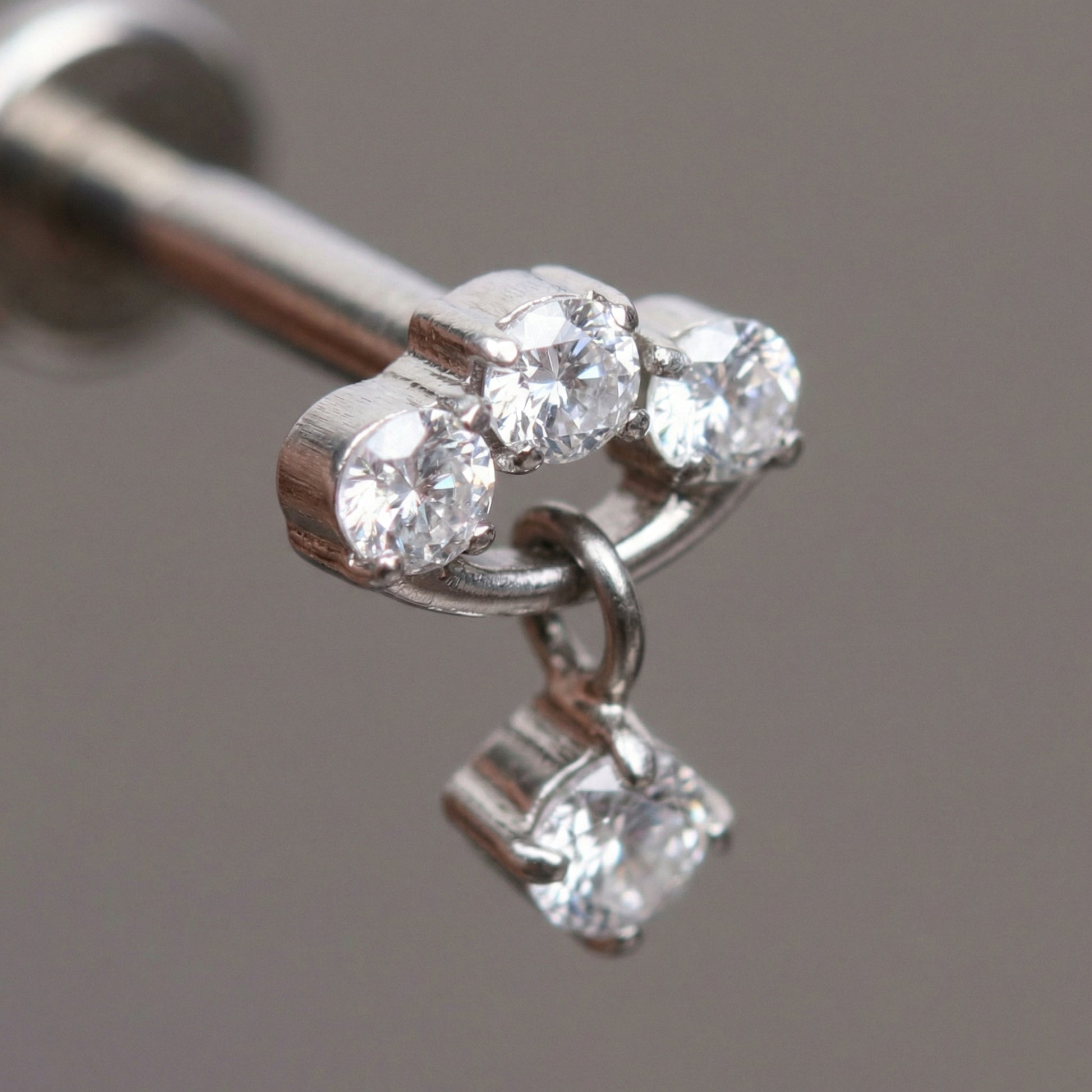 Zircon Forward Helix Piercing - Macro close-up of a