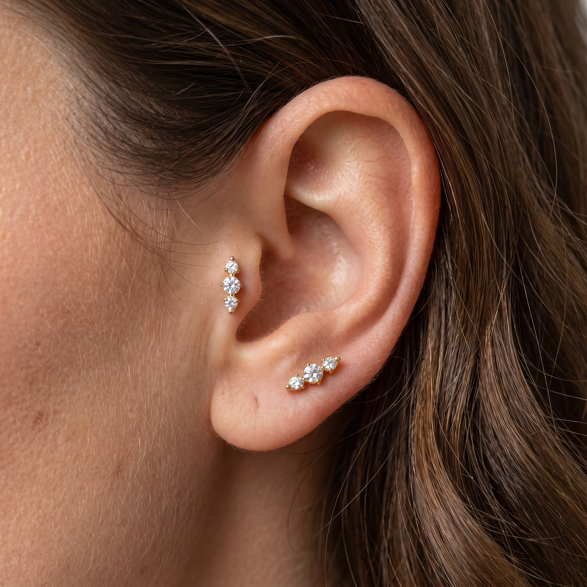 Tragus And Antitragus Piercing - Model showcasing a gold