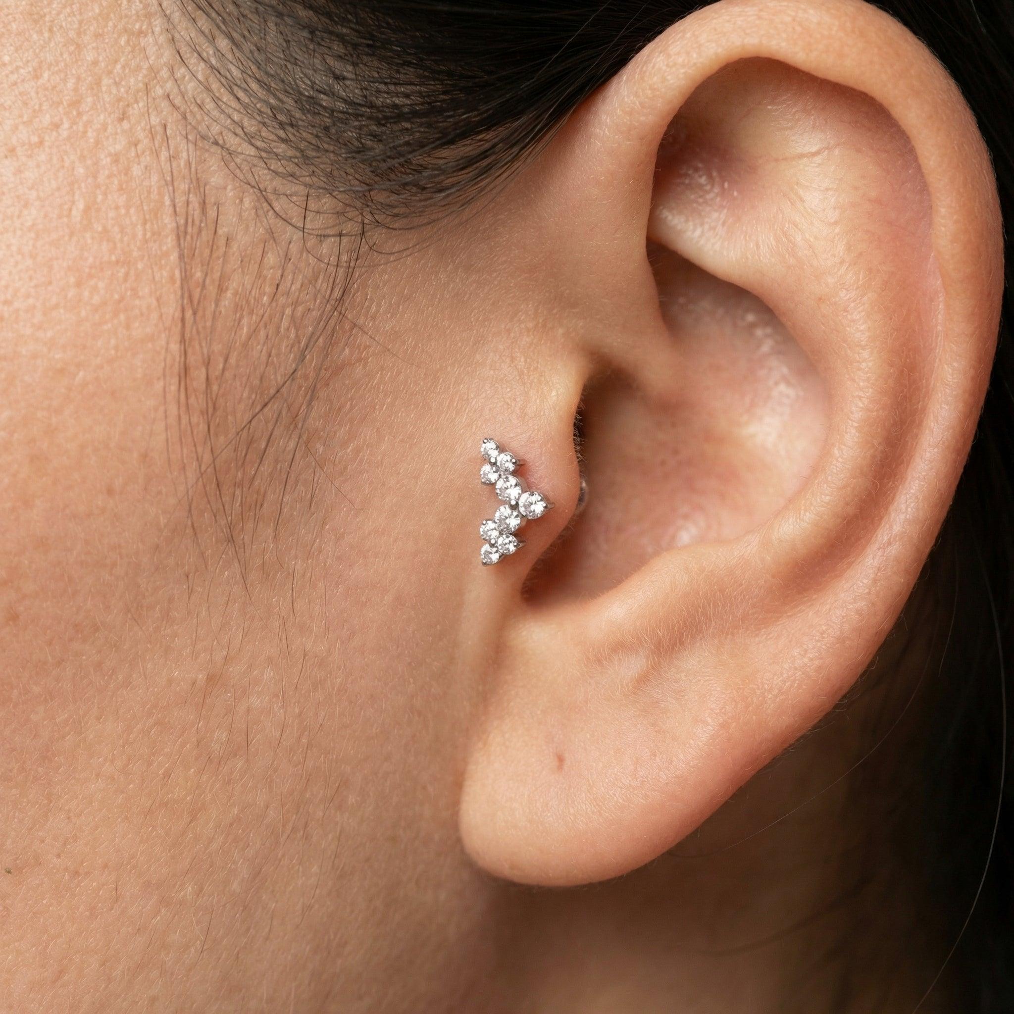 Model showcasing a silver elegant cluster zircon perfectly placed in an inner