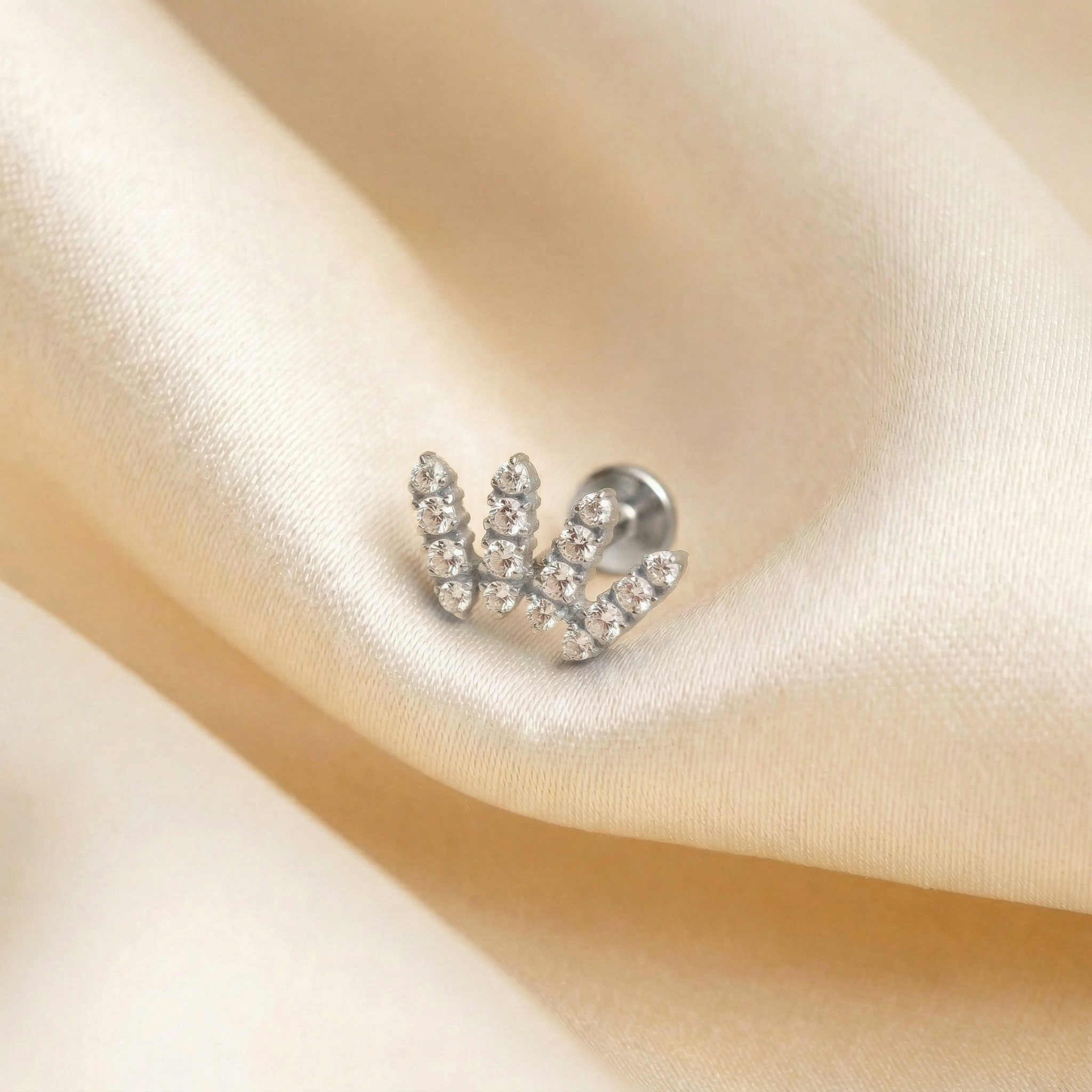 Zircon Double Helix Piercing - Macro shot of gold