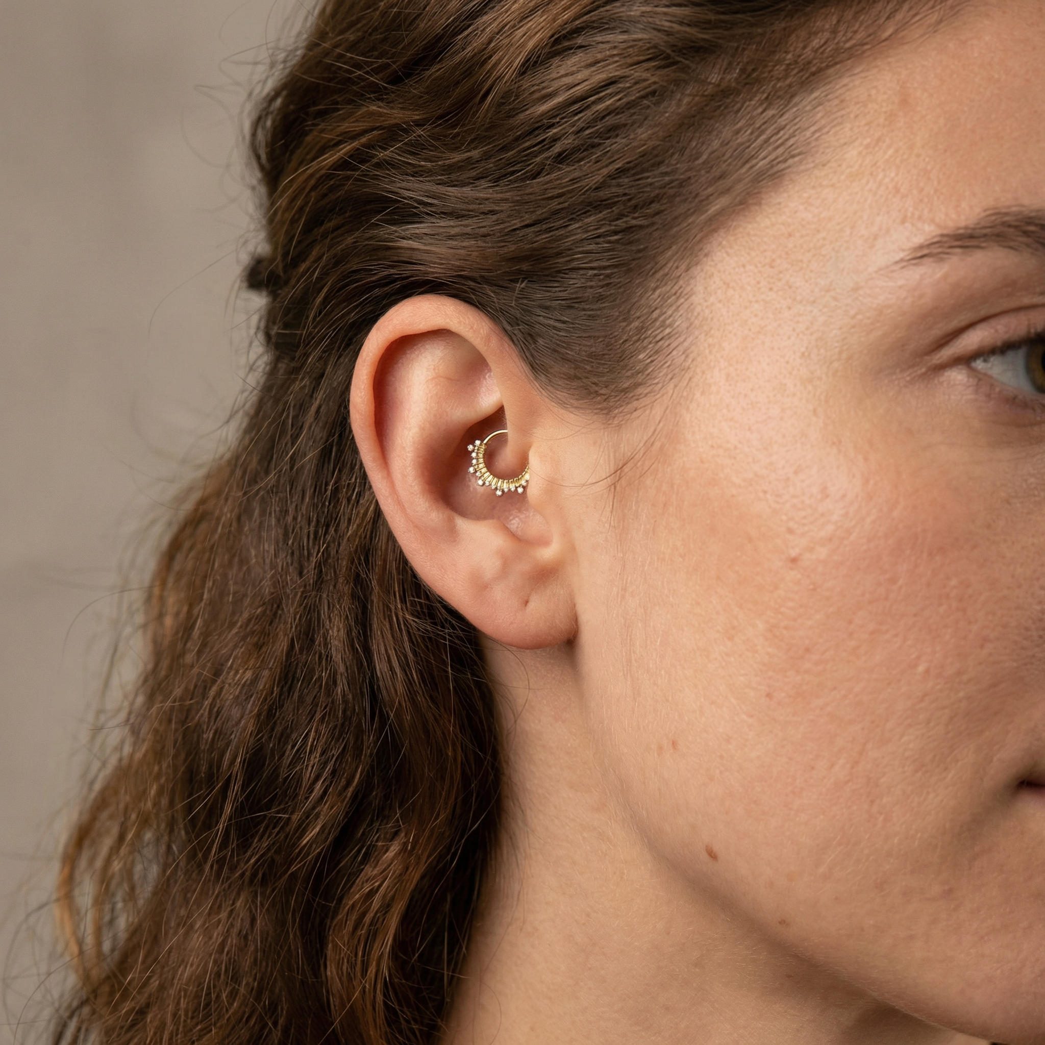 Model showcasing a gold zircon crown clicker perfectly placed in an inner