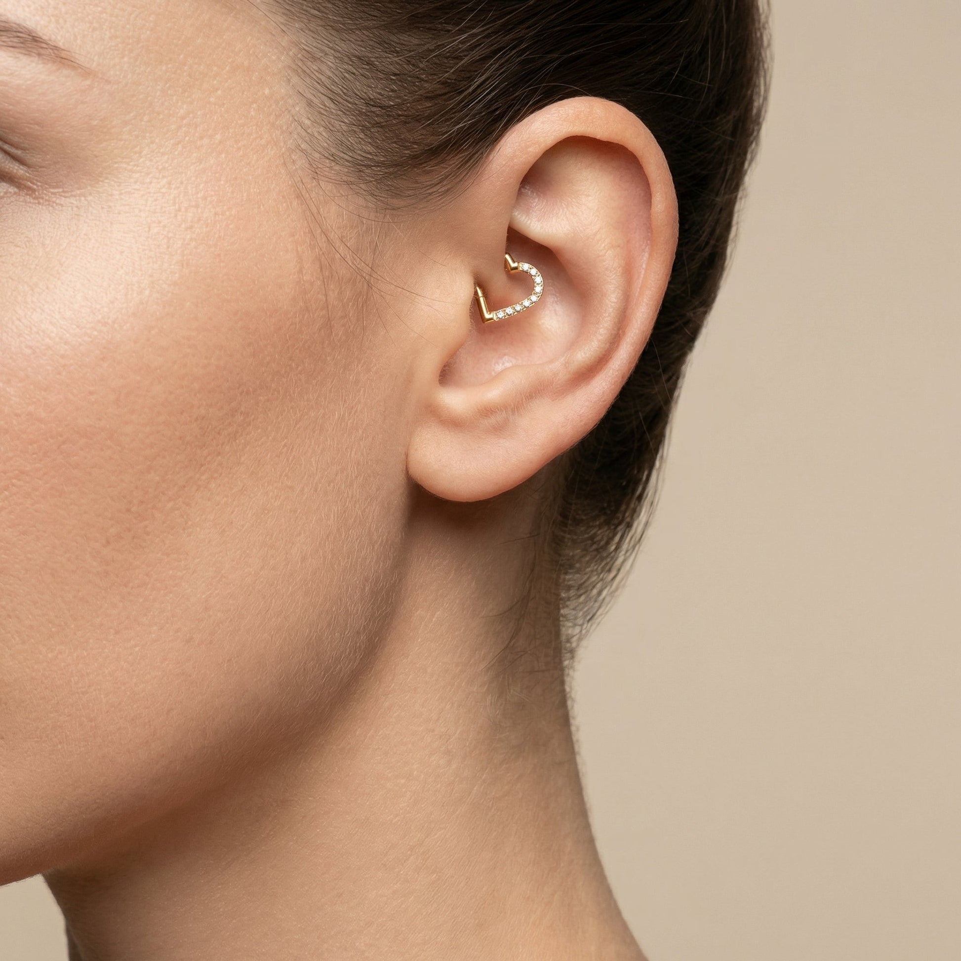 Gold zircon heart shaped stud — daith piercing placement