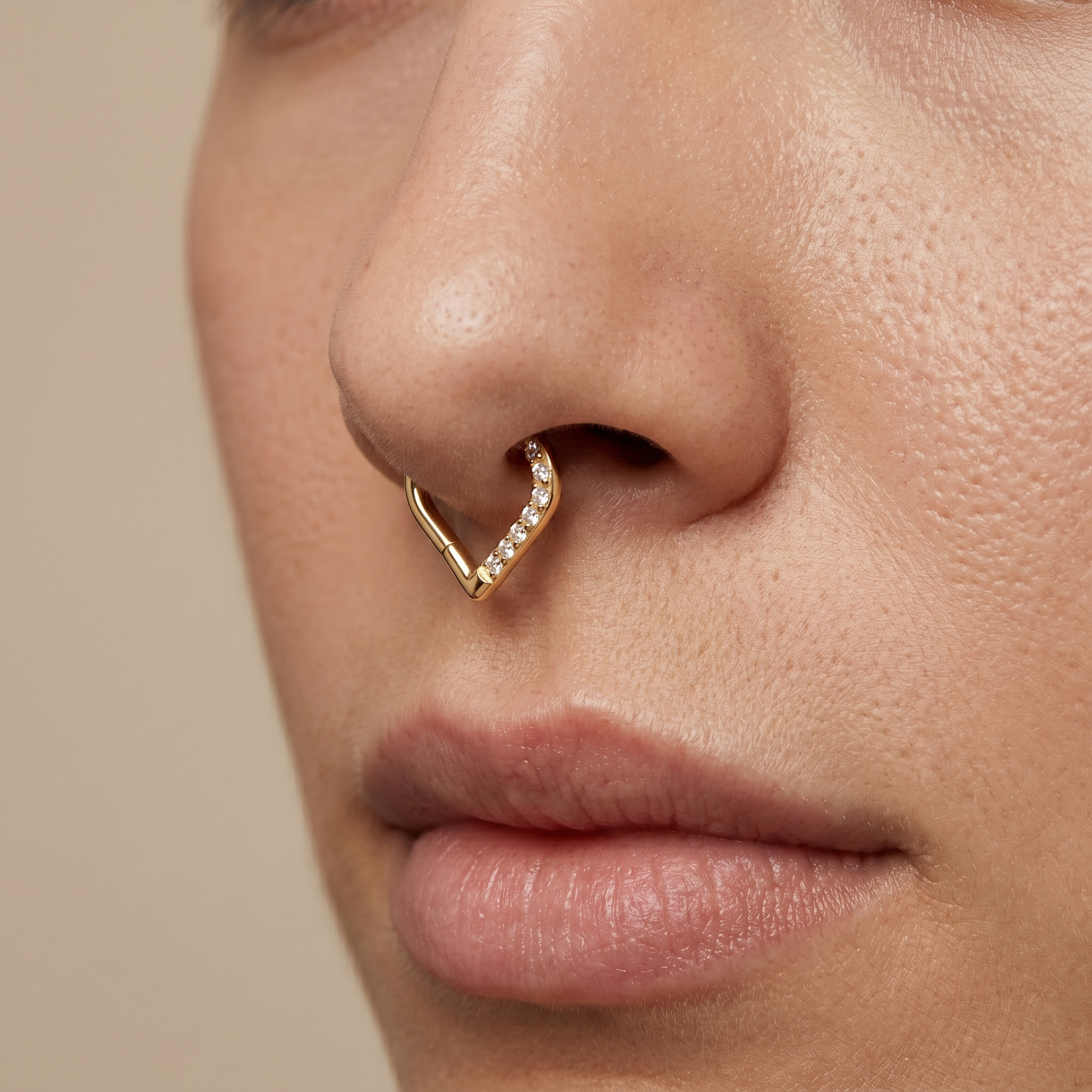 Gold zircon heart shaped stud — septum nose placement